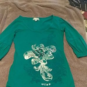 A small turquoise  half sleeve shirt